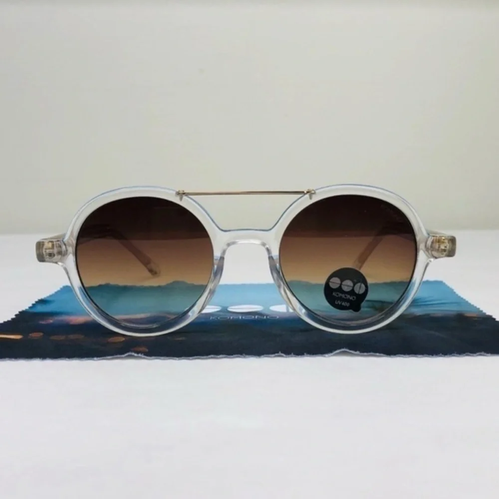 KOMONO Round Clear Sunglasses with Brown Gradient Lenses The Vivien